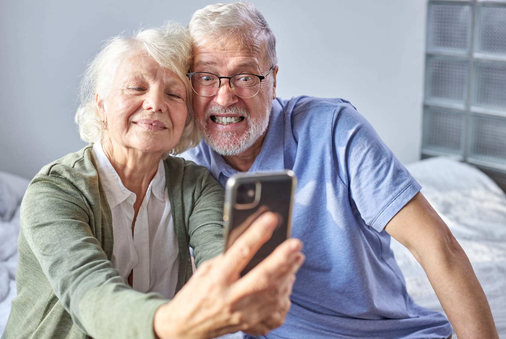 Elderly couple taking a picture together